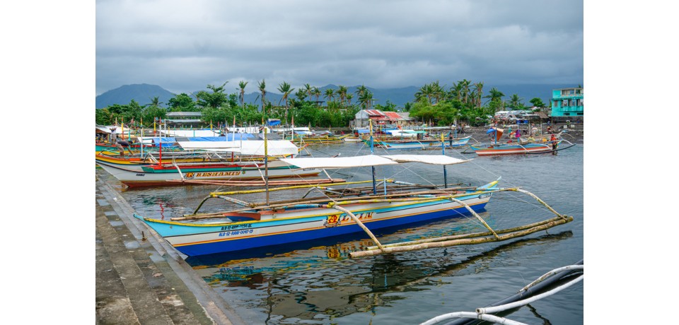 An image of boats docked in a bay in the Philippines
