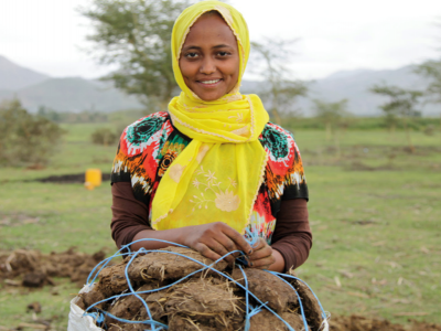 A young women performing agricultural work
