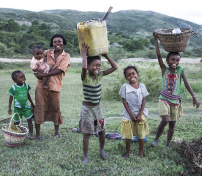 Children and their family in a rural field